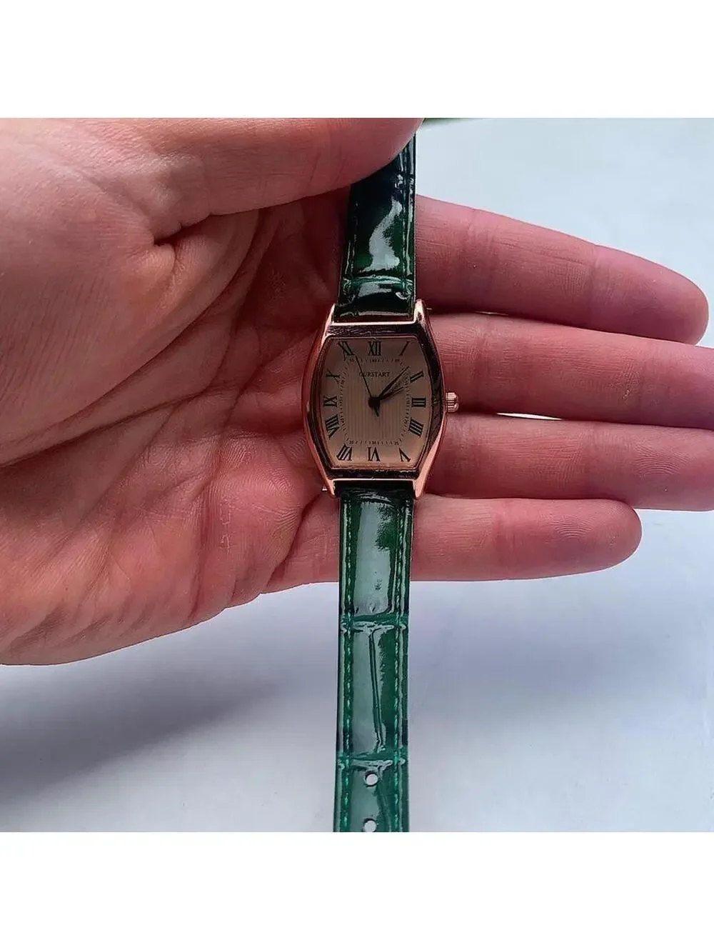 Minimalistic essential vintage style gold and green leather style band watch. 9
